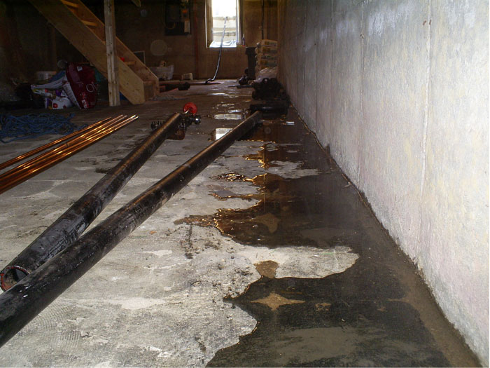 Basement wall moisture before waterproofing evaluation in Tacoma WA