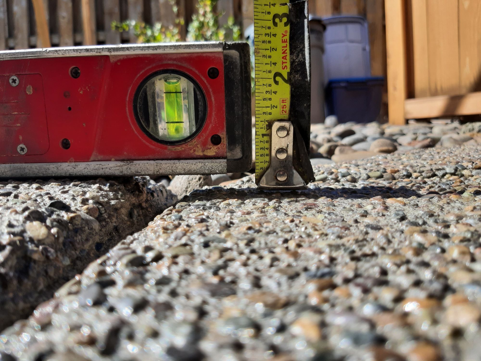 Close-up of sinking concrete showing uneven slab settlement