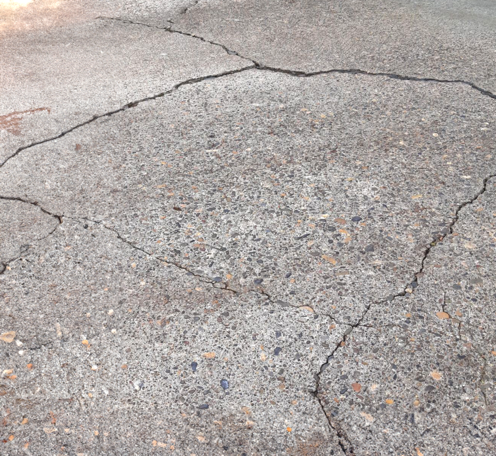cracked-concrete cracked concrete sidewalk