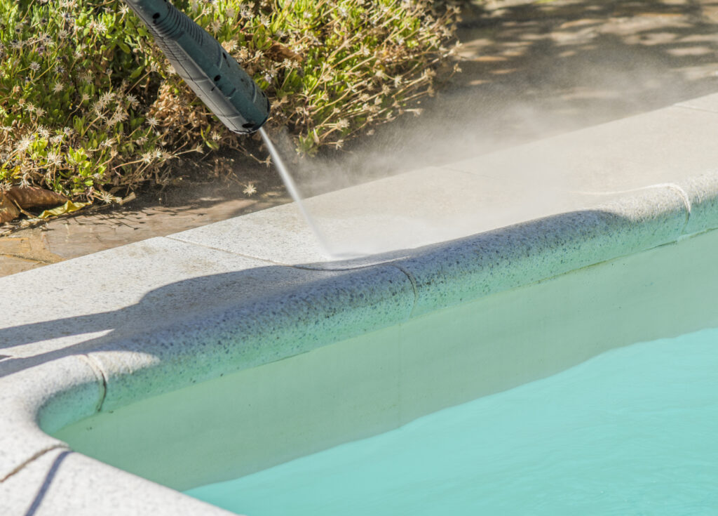Selective of a pressure pump cleaning the pool edge pressure washing pool deck Pool Deck