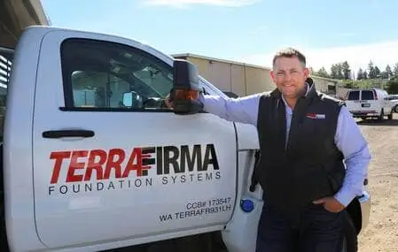 Homepage Ryan Beckley, president of Terrafirma, stands next to a truck with the company logo