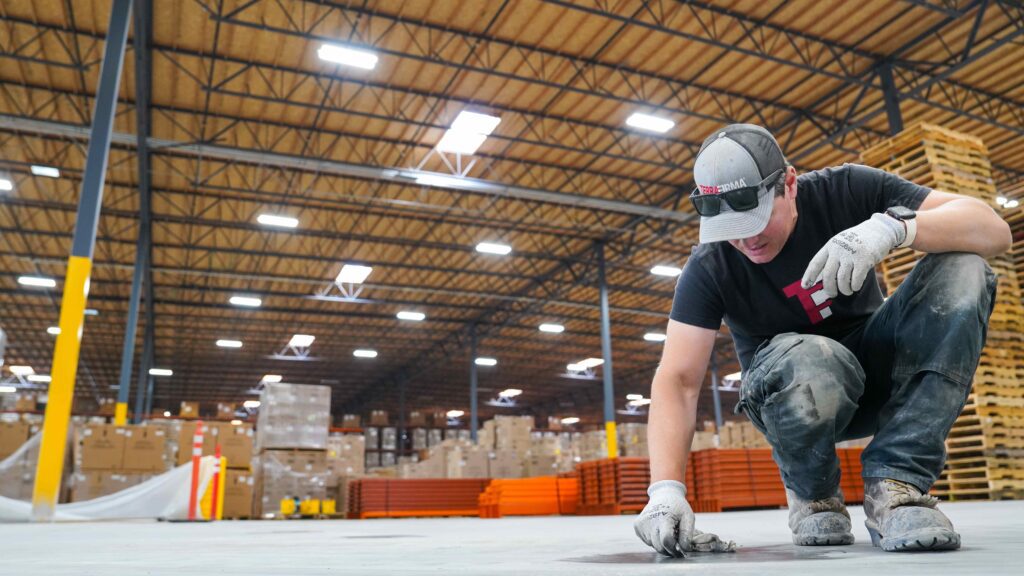 Worker Inspecting Concrete Floor 2