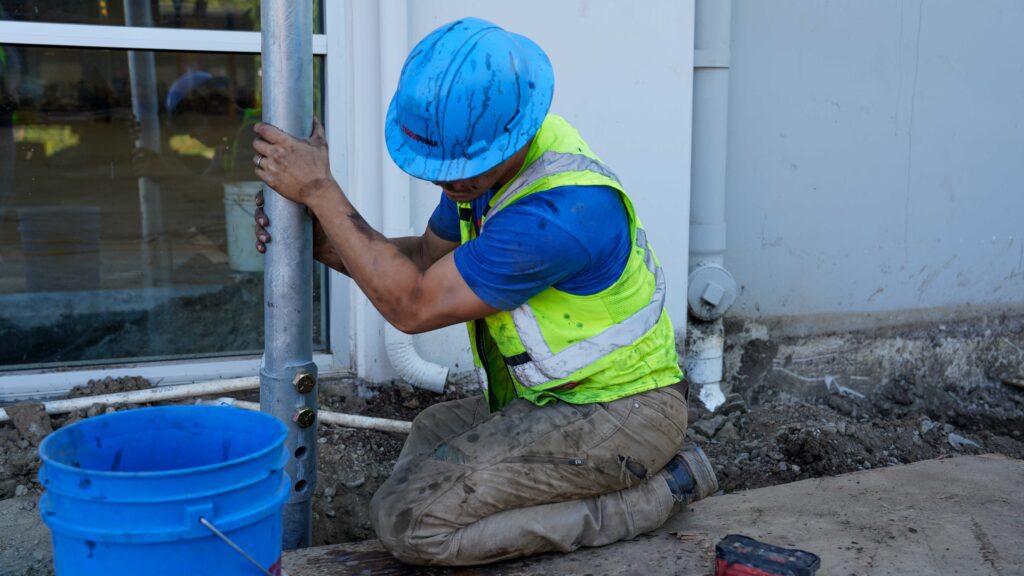 Worker Installing Foundation Pier 3