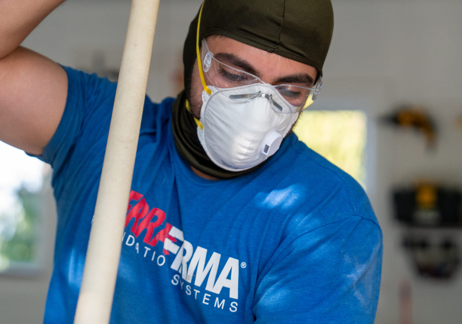 Epoxy Flooring in Olympia WA | TerraFirma TerraFirma crew preparing a concrete floor for epoxy flooring